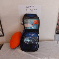 Junior snorkeling snorkeling kit displayed with Speedo bag, mask, tube, fins, and orange floating football.