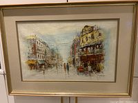 Framed mid-century modern oil painting depicting a city street with pedestrians and buildings on both sides.