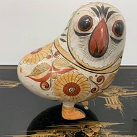Front and side view of vintage Tonala pottery bird, showing detailed paint and facial features.
