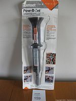 Full view of the Ramset Pow-R-Set HD22 fastening tool in its original clear plastic and cardboard packaging showing the front of the tool and instructions.
