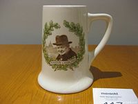 Front view of ceramic stein showing Winston Churchill portrait and laurel wreath design.