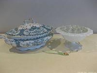 Photo of Warwick covered serving dish with detailed lid and milk glass frog on pedestal