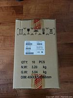 Sealed shipping box containing 10 Lenovo USB Soundbars, showing part number and weight details.