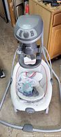 Graco DuetSoothe Swing and Rocker portable rocker seat with control panel and base frame.