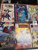 Photo showing six comics including Sky Pirates of Valhalla (two issues), Magnus, Spawn, Harbinger, and Judgment Day.