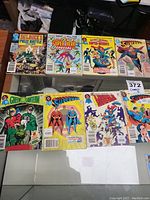 Photo showing 10 Blue Ribbon Digest comic books including Sgt. Rock, Super Hero Special, Secret Super-Heroes, Superman, Green Lantern, and Superman family issues.