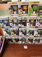 Funko Pop figures from Street Fighter and Star Wars displayed in original boxes stacked on a table.