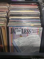 Photo showing Jammy's Various Artists record with track listings on cover, colorful striped background.