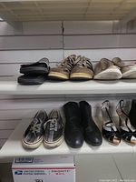 Two shelf views of various men's and women's shoes, some sneakers, casual, formal and sandals.