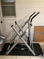 Side view of Gazelle exercise glider showing frame and pedals