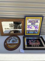 Four framed beer-themed mirrored signs displayed on a white surface.