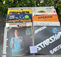 Photo showing front covers of the vintage vinyl records including James Taylor, Johnny Mathis, and others