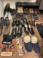 Overview of all shoes in assortment, including boots, casual, dress, sandals, slippers and accessories on floor
