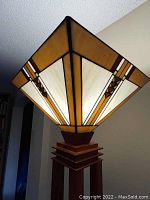 Close-up of the stained glass geometric lampshade with amber, cream, and brown colors.