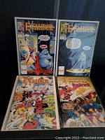 Four Marvel Excalibur comic books shown in plastic protective sleeves against a black background.