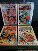 Four Marvel Universe comics in protective sleeves showing covers for volumes K-M, M, N-P, and Q-S.