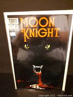 Front cover of Moon Knight comic showing title, issue number 29, cover price and striking black cover art with blood effect.