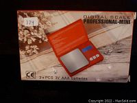 Box front showing Digital Scale Professional-Mini with an image of the scale and key features. Box states it uses 2 x 3V AAA batteries.