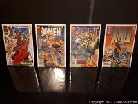 Photo showing all four The Astonishing X-Men comic books #1-4 laid out standing upright and visible.