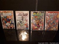Four Wild C.A.T.S. comic books issues 1 to 4 arranged side by side in protective sleeves, showing front covers