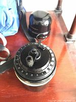 Top view of Curta calculator showing numbered digit dials and crank base
