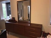 Front view of dresser and mirror showing overall design and finish