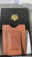 Money clip and card holder displayed inside a black Barrington box with gold embossed logo on the lid.