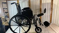 Full side view of Invacare Tracer EX2 wheelchair showing frame, wheels, armrests, and leg rests