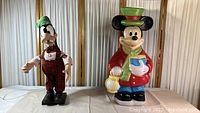 Full view of Goofy and Mickey Mouse decorations side by side showing sizing and overall appearance