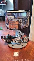 Full view of Harley Davidson lamp showing the motorcycle base and decorated lampshade