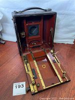 Camera opened showing bed, bellows, and struts