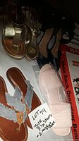 Photo showing all shoes and the shoe rack box marked with lot info.