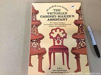 Front cover of the book showing the title and illustrations of Victorian-style chairs