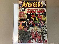 Front cover of The Avengers #5 comic book from 1964 titled 'The Invasion of the Lava Men' featuring colors and characters Thor, Iron Man, Captain America and others in action against lava men.