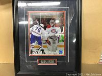 Framed 8x10 hockey photo featuring players Carey Price and P.K. Subban with signatures and name plaque below.