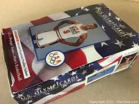 Closed wax box with U.S. OlympiCards branding and athlete image on top.