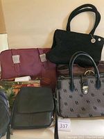 Overview photo showing multiple handbags including Dooney & Bourke tote, black woven bag, brown bag, burgundy bag, and black crossbody bag.