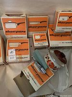 Cookware boxes showing illustrations and labels of Show Pans brand cookware in new condition.