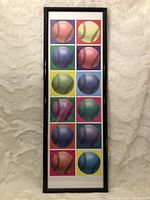 Front view of the framed poster displaying colorful baseball images in a 5x2 grid within a black plastic frame.