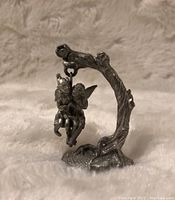 Front angle showing two fairies on swing attached to tree branch base