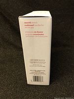 Side panel of the box showing features: smooth stretch, cushioned handles for secure grip.