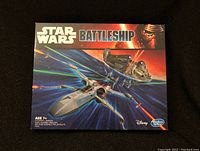 Front cover of Star Wars Battleship game box with Star Wars and Hasbro logos, showing artwork of Star Wars ships.