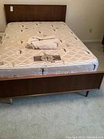 Assembled double bed frame in teak veneer with headboard and mattress