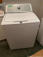 Front view of Maytag Bravos X washer showing overall condition and finish