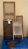Full group of antique decor items including shelf, washboard, bookends, wire mesh panel, and wooden frame.