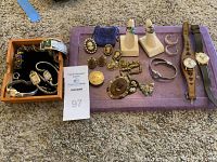 Wooden box with assorted bracelets and two watches