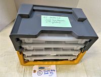 Stacked two-set yellow and gray plastic storage tray with clear drawers and a note describing the lot.