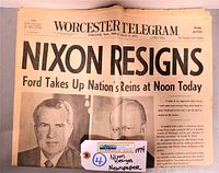 Full front page of the newspaper showing headline Nixon Resigns with Nixon image and auction tag