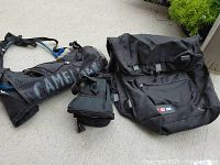 Photo showing three bicycling bags: Camelbak hydration pack, Avenir seat bag, CCM large pannier