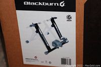 Close-up of Blackburn Trackstand Mag 3 bike trainer image on box showing the product and logo.